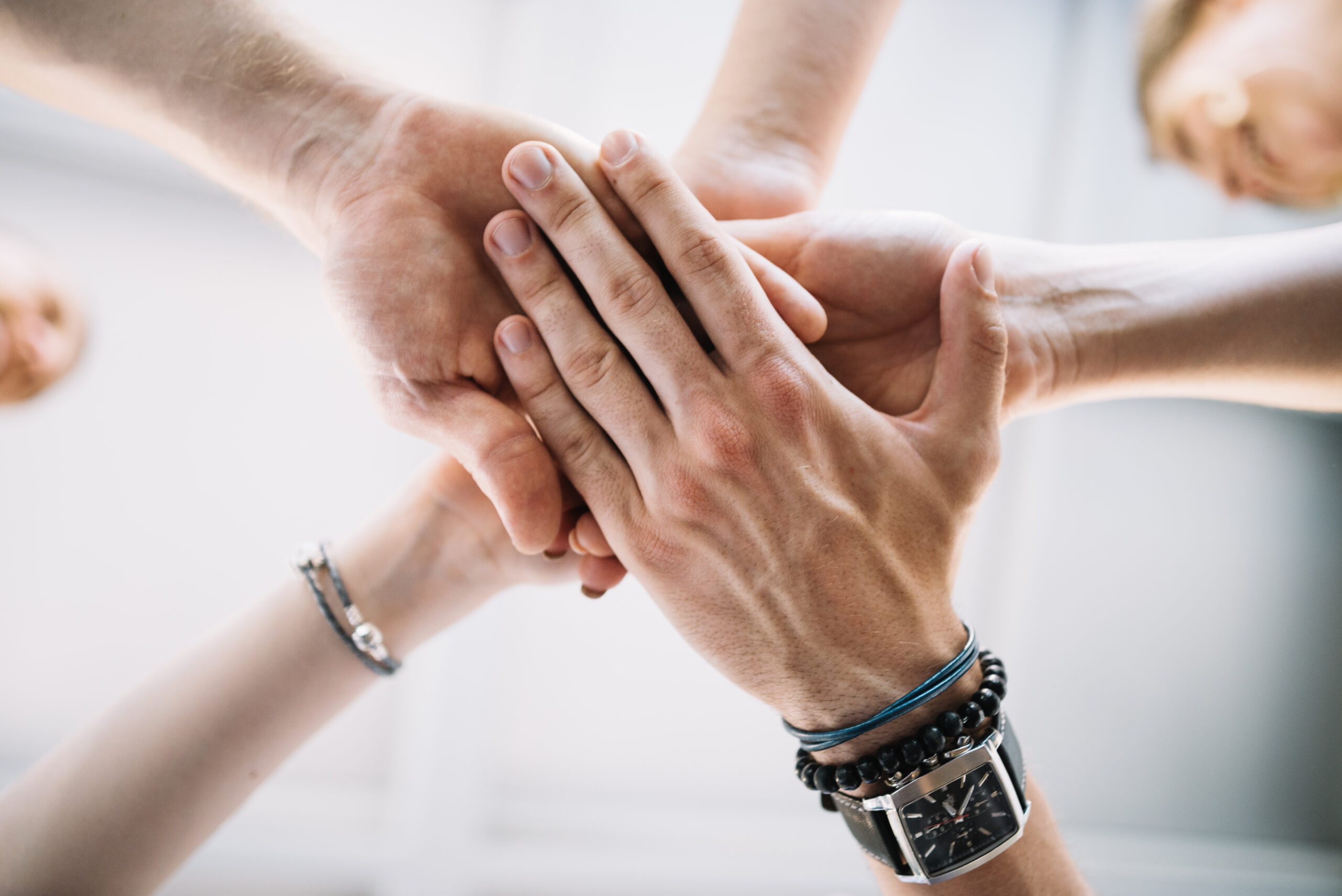 close up joined hands